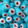 Rock candy with a blue outter wrap and a centered red love heart. Lemonade flavour.