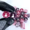 Pink & white striped bride and purple & white striped bride. Same-sex wedding candy.