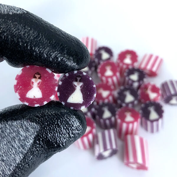 Pink & white striped bride and purple & white striped bride. Same-sex wedding candy.