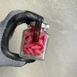 80g jar of Raspberry flavoured sour drops.