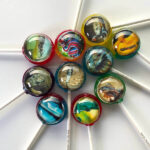 Reptile lollipops with frightening designs of crocodiles, snakes, goannas, frilled-neck lizards, chameleons and turtles.