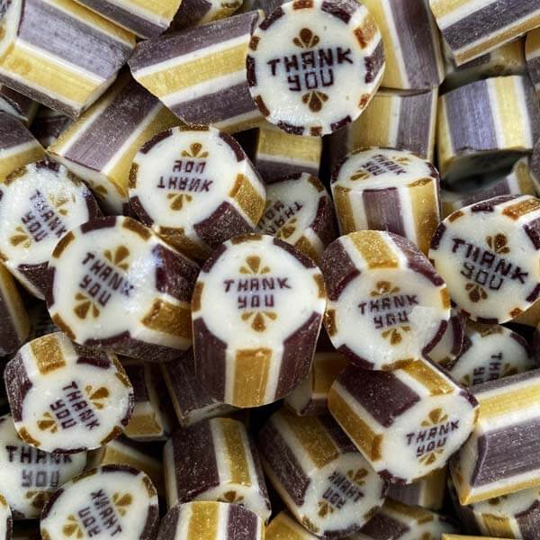 Gold and silver striped 'Thank You' candy with a grape flavour. Suitable for weddings. Vegan friendly.